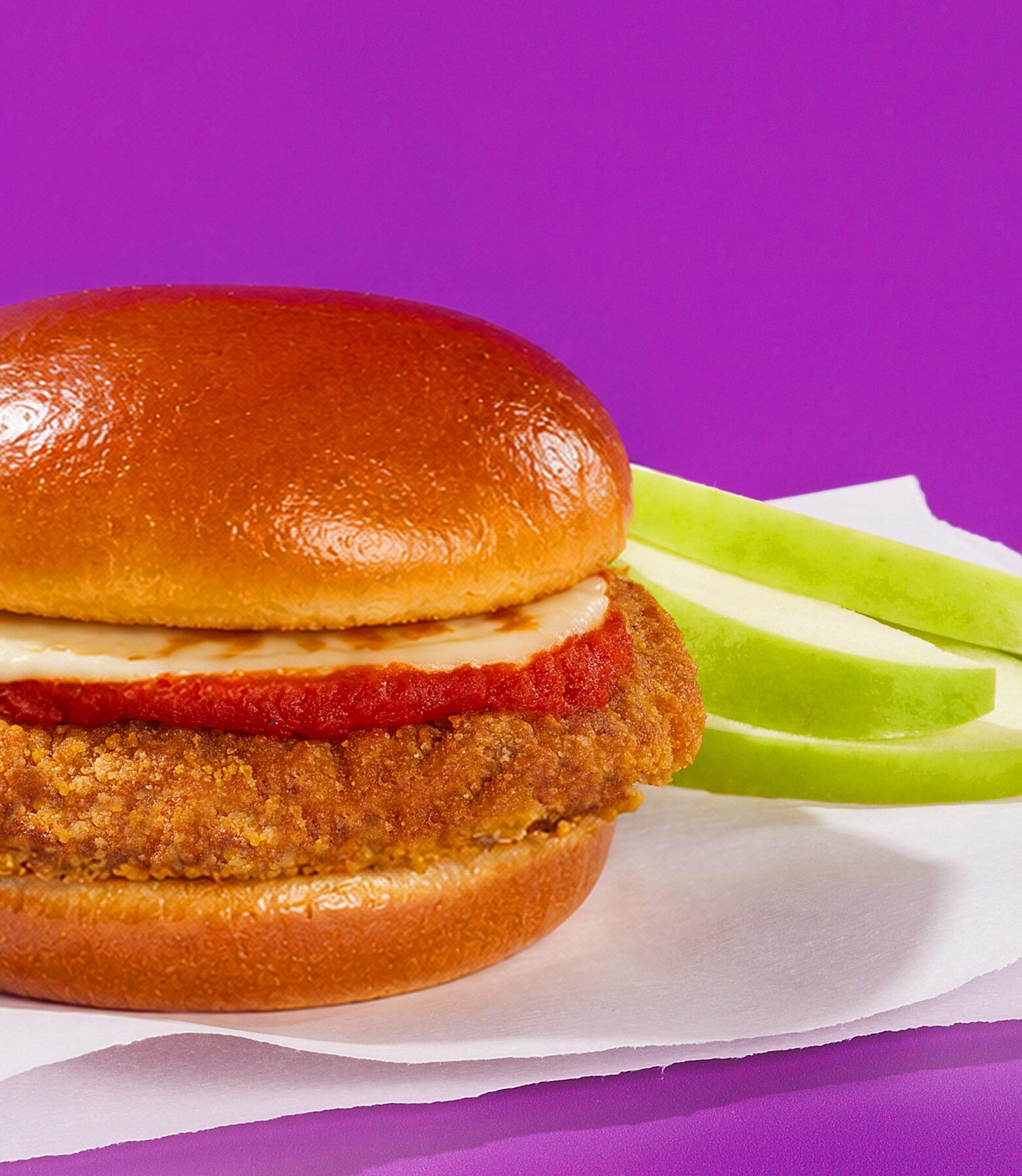 Breaded beef parm sandwich with marinara and melted cheese on a toasted bun