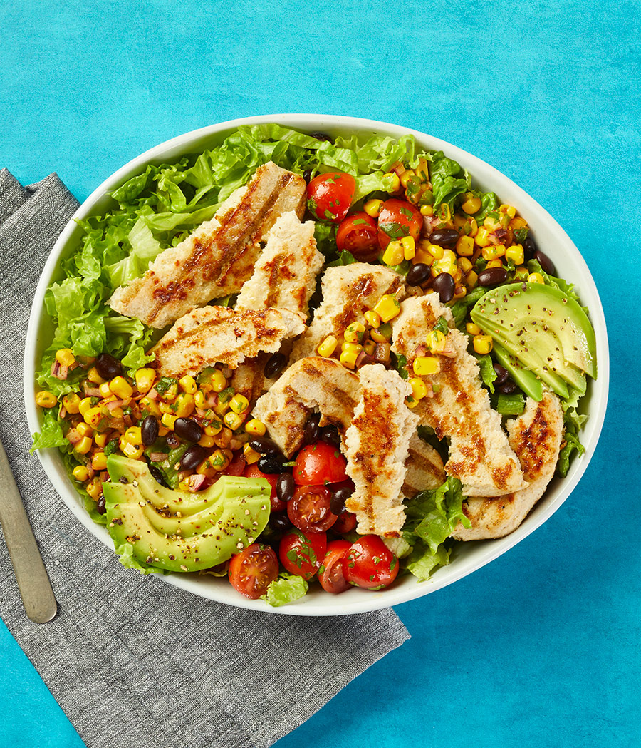 Southwest grilled chicken salad with corn, black beans, tomato and avocado