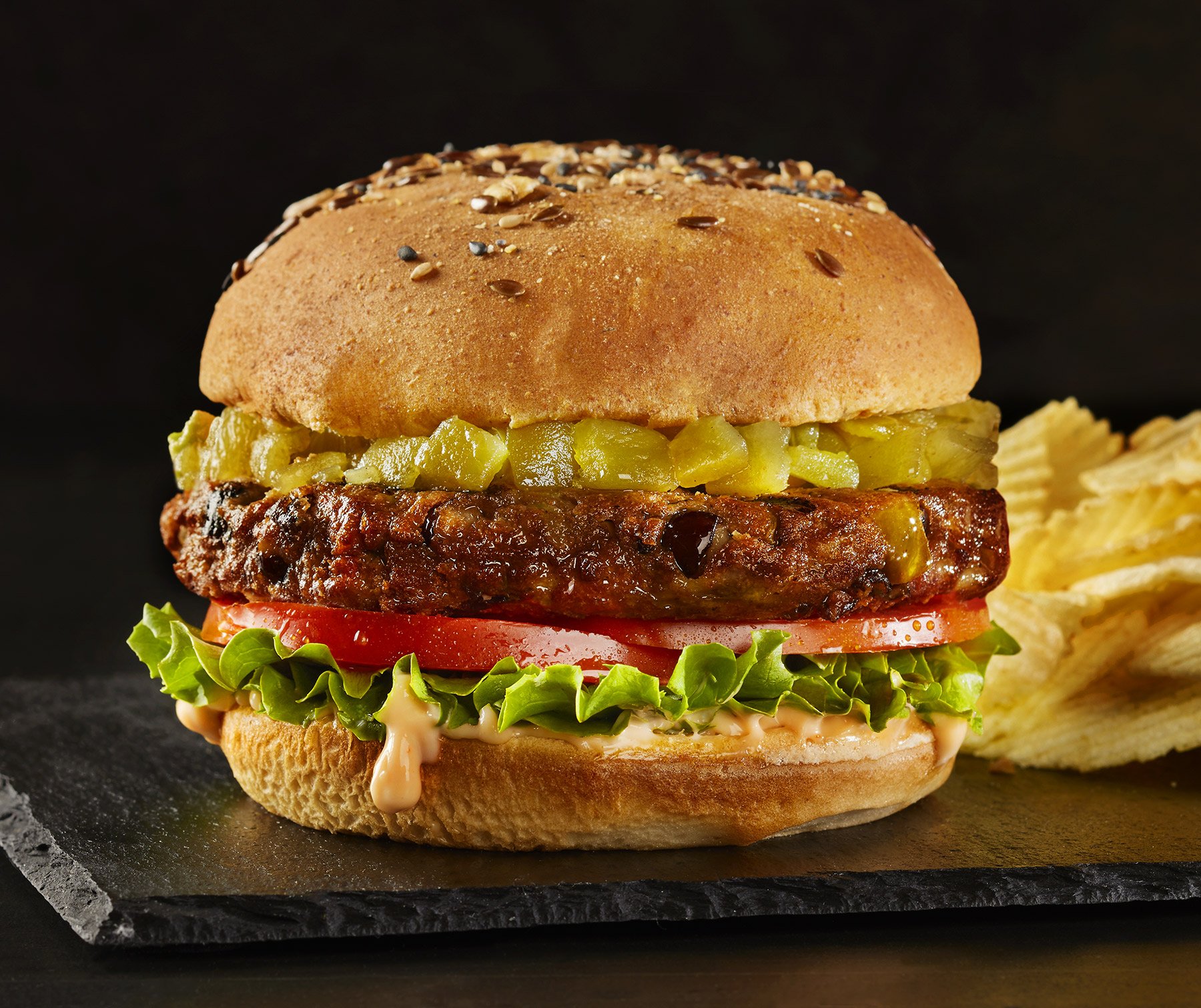 Green chile black bean burger with chips