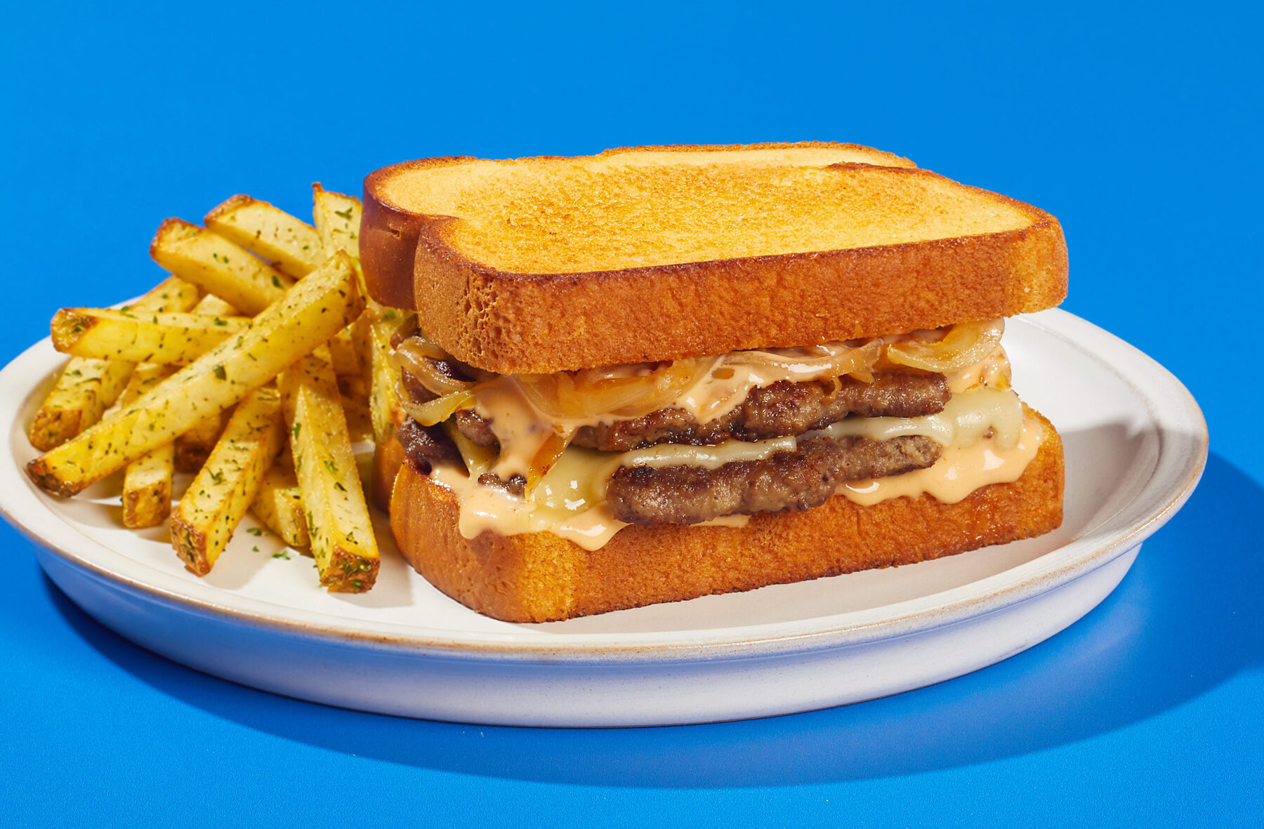Texas toast patty melt on griddled bread